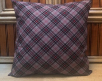 May include: A gray and red plaid throw pillow with a square shape.