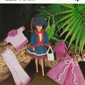 May include: A doll wearing a blue and red knitted outfit, hat, and purse, with matching pink knitted skirt, top, and pants. The image includes the text "ARGYLL DOUBLE KNITTINGS TO FIT DOLL LENGTH 12 INCH".