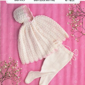 May include: A cream-coloured knitted baby outfit with pink edging, comprising a hooded cape and leggings. The image shows the text "Midgley and Catton" and "555". Sizes are 40-48 cm.