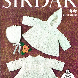 May include: A knitting pattern for a white baby cardigan and bonnet. The pattern is from Sirdar and is for a 3-ply yarn. The pattern is for a baby from birth to 3 months.