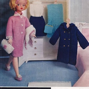 May include: A vintage doll wearing a pink knitted coat, matching shoes, and a headband. A white wardrobe displays knitted doll clothing, including a blue coat and a skirt and top set. The image includes the text "Ladyship WOOLS".