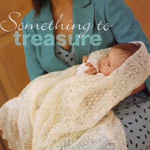 May include: A woman in a teal blazer holds a baby wrapped in a white crocheted shawl. The shawl is delicate and lacy, and the baby is sleeping peacefully. The text "Something to treasure" is written in a decorative font across the image.