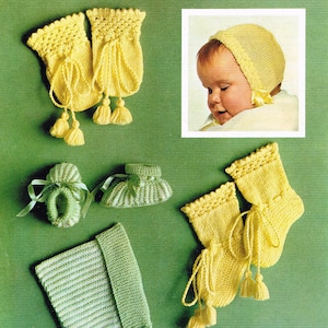 May include: A collection of knitted baby clothes in yellow and green. The image shows booties, socks, a bonnet, and mittens. The text reads "Patons Beehive Baby Wool 3-ply" and "First size, up to 6 months".