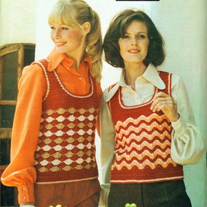 May include: Two women wearing crocheted vests. The vest on the left is a red, white, and brown geometric pattern. The vest on the right is a red, white, and pink chevron pattern. The text on the image reads "Patons 2478 8p Totem Double Crepe 32-36 in. Crochet."