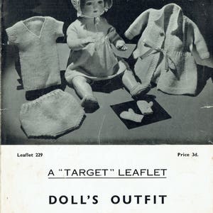 May include: A knitting pattern for a doll's outfit, including a dress, cardigan, bonnet, and mittens. The pattern is made with "Target" Cherub 3-ply wool.