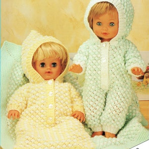 May include: Two dolls dressed in handmade, hooded outfits. One doll wears a yellow outfit, the other a mint green jumpsuit. Both outfits feature a textured bobble stitch design and button fastenings. The text at the bottom reads "FOR DOLLS AND PREMATURE BABIES."