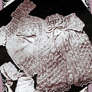 May include: Vintage sepia-toned baby clothing set, including a dress, bonnet, and booties. The garments feature intricate lace detailing and a delicate bow. The set is displayed on a dark background with a decorative border.