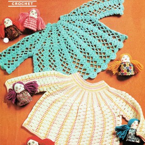 May include: A vintage crochet pattern showing two baby sweaters and dolls. The sweaters are in light blue and cream with pink and yellow stripes. The pattern is for 48-51 cm baby sweaters. The word "PATONS" is at the top, with "CROCHET" below.