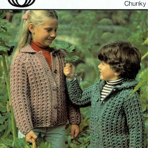 May include: Vintage knitting pattern featuring two children wearing chunky knit cardigans. The girl wears a pinkish-brown cardigan, and the boy wears a green cardigan. The pattern is labeled "Chunky" and includes the Sirdar logo.