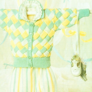 May include: A knitted baby cardigan and matching pants in a green and yellow striped pattern. The cardigan has a button closure and a white lace collar.