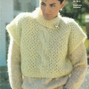 May include: A cream-colored knitted sweater with a cable knit pattern and a high neck. The sweater has short sleeves and is made of mohair and cotton. The sweater is 30-38 inches in length.
