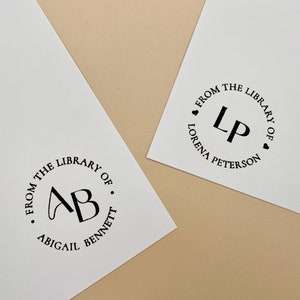 May include: Two white cards with black ink circular stamps. The first stamp says "From the Library of. AB. Abigail Bennett". The second stamp says "From the Library of. LP. Lorena Peterson".