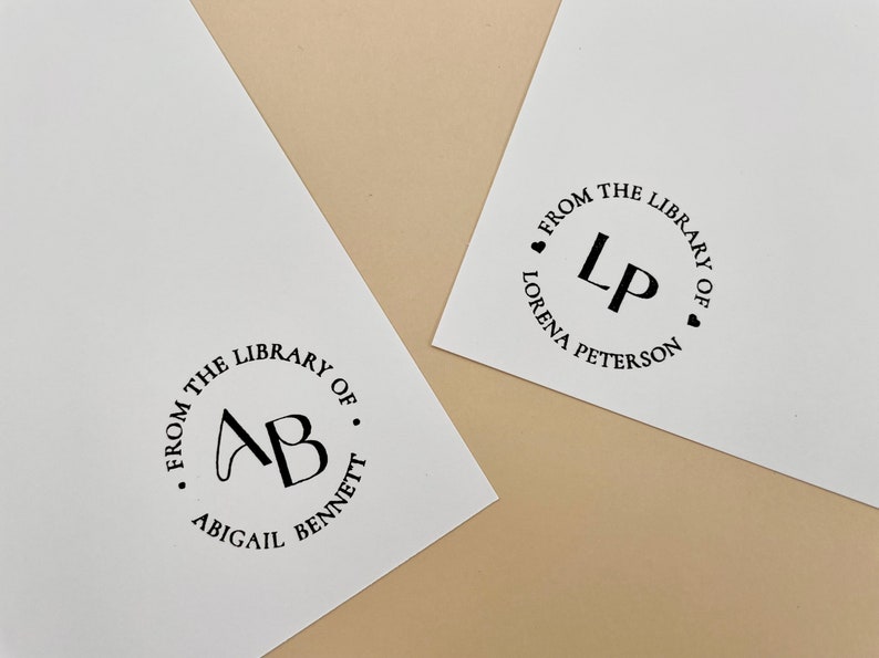 May include: Two white cards with black ink circular stamps. The first stamp says "From the Library of. AB. Abigail Bennett". The second stamp says "From the Library of. LP. Lorena Peterson".