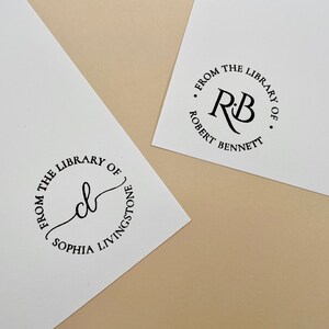 May include: Two round, black and white, self-inking stamps with text that reads "From the Library of" and the name of the owner. The first stamp has the initials "R.B." and the name "Robert Bennett". The second stamp has the initials "S.L." and the name "Sophia Livingstone".