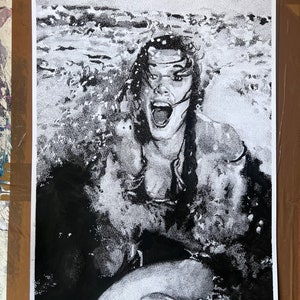 May include: Black and white stipple illustration of a woman with long hair emerging from water. The woman is looking up and has her mouth open in a scream. The text 'Carrie Fisher' is in the bottom left corner of the image.