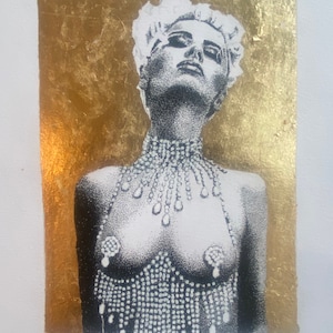 May include: A black and white illustration of a woman wearing a beaded necklace and a beaded top. The background is gold.
