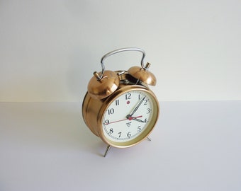 Working large retro alarm clock.Antique alarm clock.Collectible clock. Mechanical alarm clock.Home gift.Ringing clock.Gift idea.