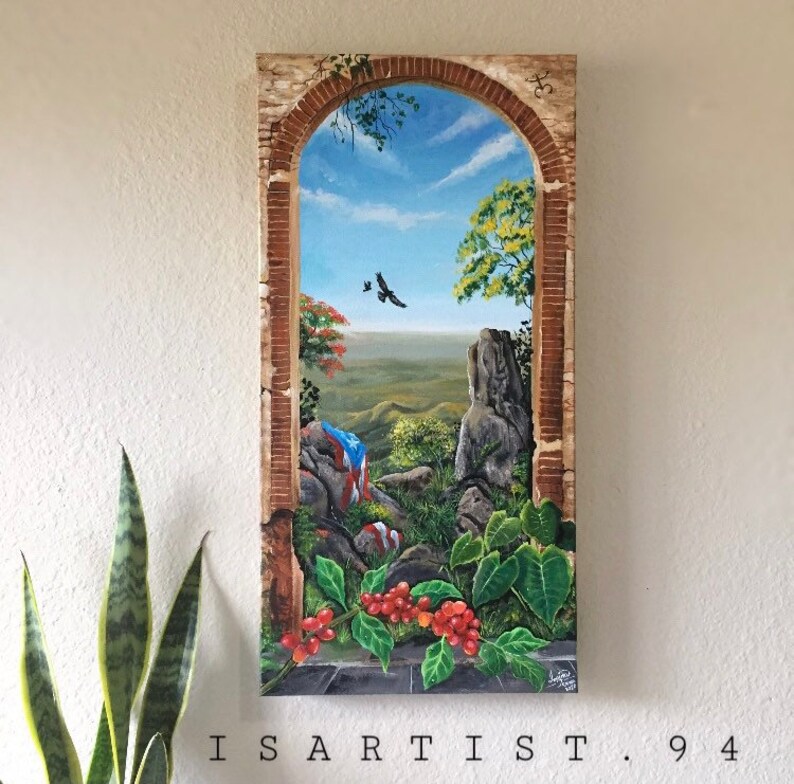 May include: A painting of a landscape scene through an arched window. The scene includes a rocky hillside, green trees, a blue sky with white clouds, and a Puerto Rican flag. The painting is framed in a brown wooden frame.