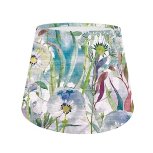 May include: A white lampshade with a watercolour floral pattern featuring blue, green and pink flowers and leaves.
