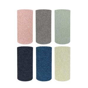 May include: Six fabric drink sleeves in various colours. The sleeves are cylindrical and made of a textured material. Colours include pink, grey, green, navy, blue, and light yellow. These sleeves are designed to keep beverages cold.