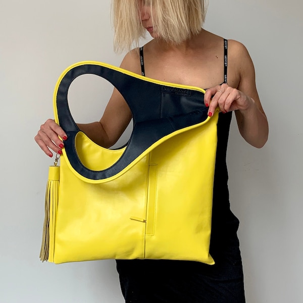 Bolso tote de piel amarillo y negro: bolso bandolera único y holgado con borla. Bolso shopper con abertura grande para la sisa.