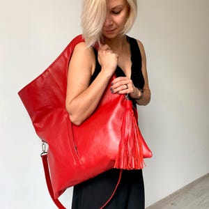 Red leather hobo bag with pocket Oversized shoulder bag Genuine leather purse Unique handbags women Big tote bag Bright purse with tassel