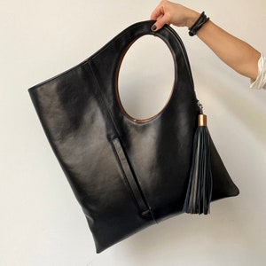Unique leather handbag with front pocket Black soft leather tote bag for women personalized Oversized hobo purse Leather bag with tassel