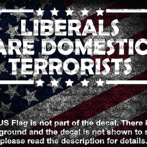 May include: A graphic with the text "LIBERALS ARE DOMESTIC TERRORISTS" in white, set against a distressed American flag background. The text is enclosed in a white rectangular frame. The bottom of the image contains additional text.