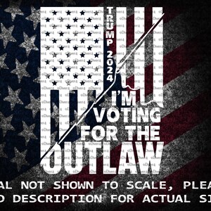 May include: A white graphic design on a red, white, and blue American flag background. The graphic design says "TRUMP 2024 I'M VOTING FOR THE OUTLAW". The text is in a bold, white font. The graphic design is a stylized image of a rifle with a red, white, and blue bandana tied around the barrel. The graphic design is surrounded by a white border.