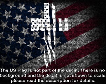 May include: A distressed American flag design with a grunge effect. The flag features the traditional red and white stripes and a blue field with white stars. The text at the bottom reads: "The US Flag is not part of the decal. There is no background and the decal is not shown to scale, please read the description for details."