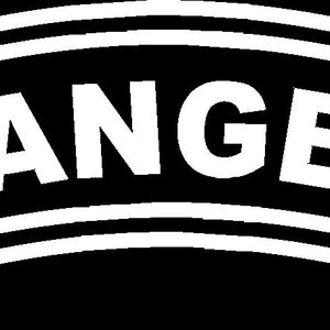 May include: A white Ranger tab with a black background. The tab is shaped like a curved rectangle with rounded corners. The word "RANGER" is printed in white letters on the tab.