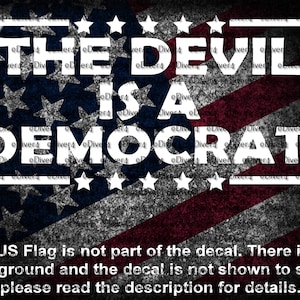 May include: A decal featuring the text "THE DEVIL IS A DEMOCRAT!" in white, set against a distressed American flag background. The design includes stars and stripes, with a white border around the text. The bottom text reads: "The US Flag is not part of the decal."