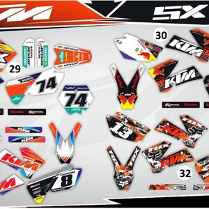 May include: A set of motocross graphics decals for a KTM SX 85 motorcycle. The decals are in various colors, including orange, white, black, and blue. The decals feature the KTM logo, the number 74, and the text "SX".