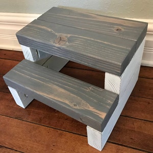 Wooden step stool, weathered gray stained steps with rustic white painted supports, personalized name hand painted on step, step stool in a kitchen, step stool against cabinet, kids step stool, adult weight