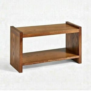 May include: A two-tiered wooden bench with a warm brown finish. The bench has a rectangular shape with a shelf below the top surface. The design is simple and modern, suitable for various home decor styles.