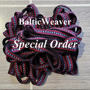 May include: A coiled length of woven trim featuring a repeating pattern of black, dark red, and light blue threads. The text BalticWeaver and Special Order is printed in white across the center of the coiled fabric trim.