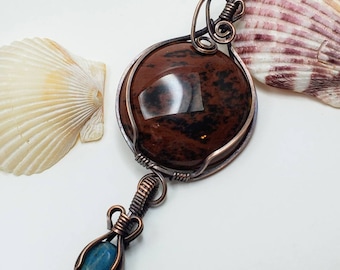 Dual stone wire wrapped copper pendant mahogany obsidian cabochon in the main pendant turqouise cabochon in the attached pendant