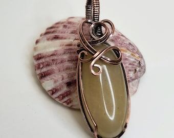 Wire wrapped pendant, antiqued copper around a creamy yellow aventurine