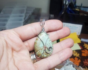 Turqouise colored magnesite bead wrapped in silver plated copper and antiqued copper wire minimalist pendant