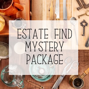 May include: A close-up of a wooden table with various antique items, including a teapot, a glass pitcher, a pair of scissors, a pocket watch, and a small metal coffee pot. The text "ESTATE FIND MYSTERY PACKAGE" is written in black letters on a white background.