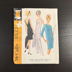 May include: Vintage McCall's sewing pattern for a dress and jacket. The pattern number is 8523, size 12, bust 32. The pattern shows three different styles of dresses, one with a long skirt, one with a short skirt, and one with a jacket.