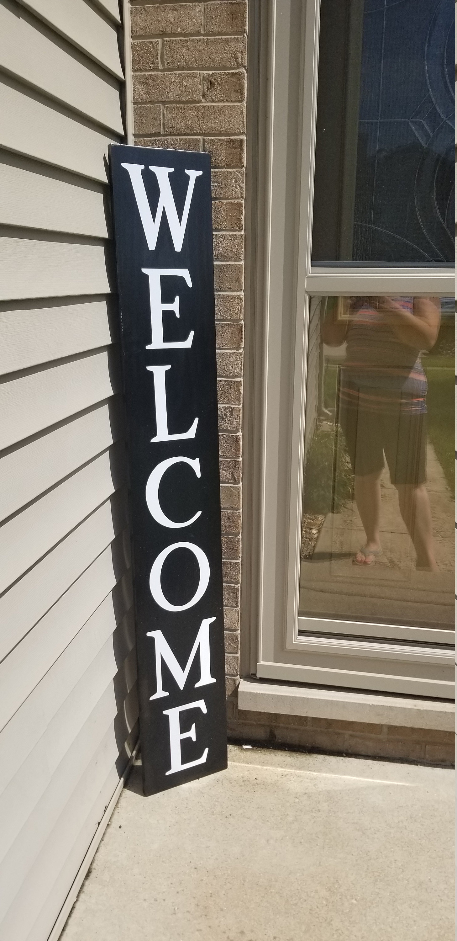 vertical wooden porch signs