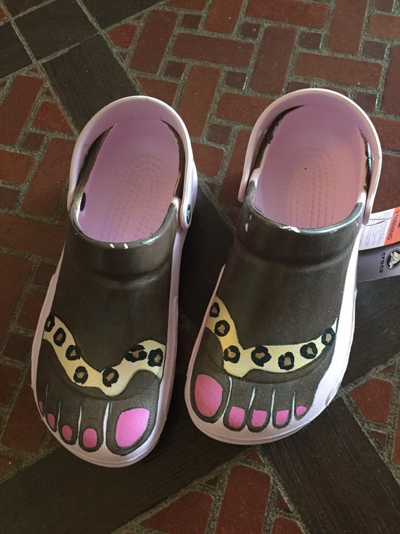 crocs with feet painted on them