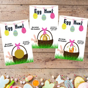 May include: Three Easter-themed game cards with the text "Egg Hunt" and colorful hanging eggs. Each card features a basket with a scratch-off area, a bunny, and the text "Scratch the basket!" and "If it has a golden egg you win!"