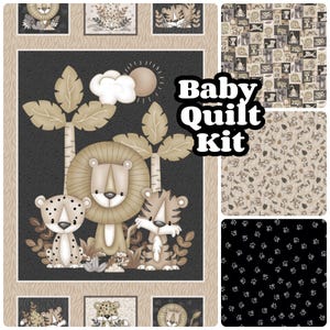 May include: A baby quilt kit featuring a jungle theme with a lion, tiger, and leopard. The kit includes a variety of fabrics with different patterns, including paw prints, animal prints, and a jungle scene. The text "Baby Quilt Kit" is printed in white on a black background.