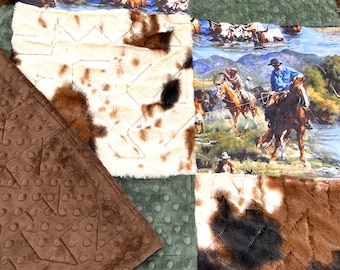 May include: A patchwork quilt with a brown, green, and white color scheme. The quilt features a variety of patterns, including polka dots, chevron, and cowhide print. The quilt is made of soft, plush fabric.