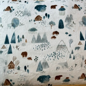 May include: White pillowcase with a woodland pattern featuring bears, mountains, trees, and cabins. The pattern is in shades of blue, brown, and grey.