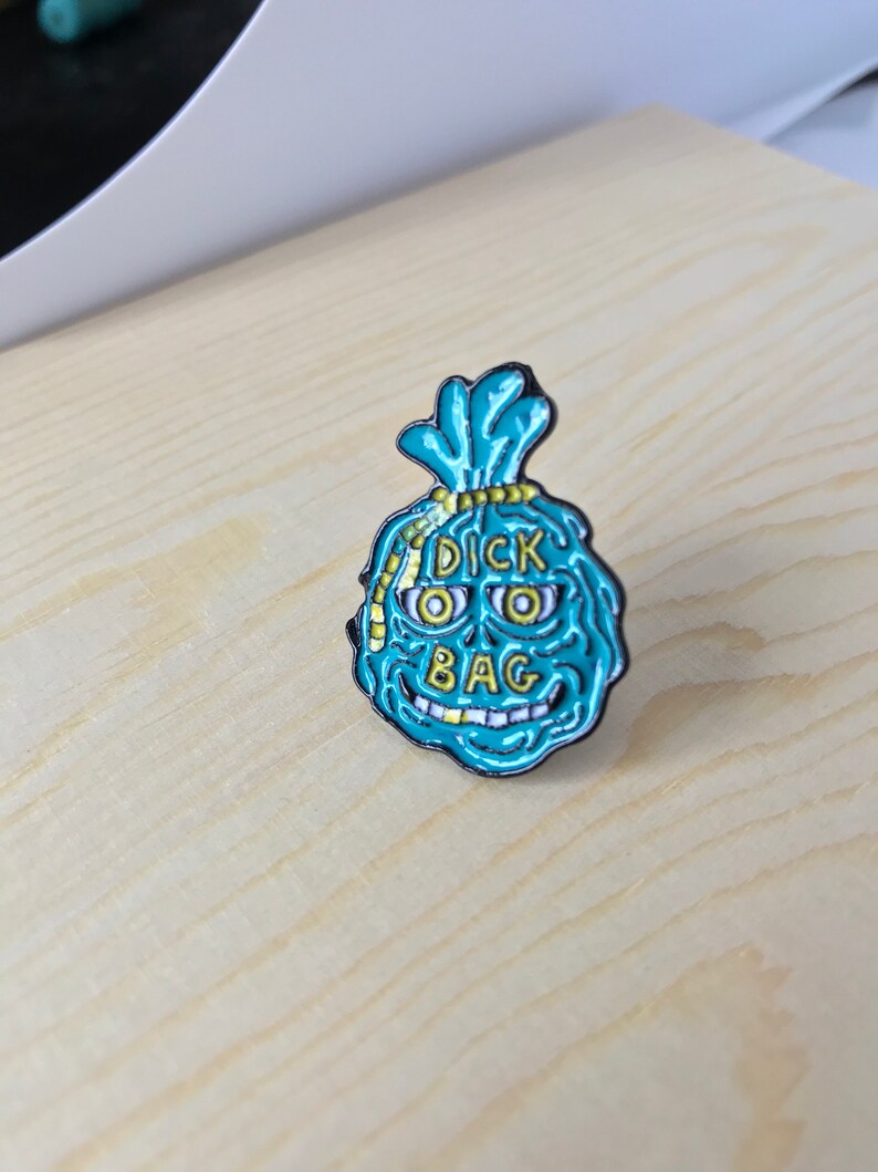 Dick bag enamel pin
