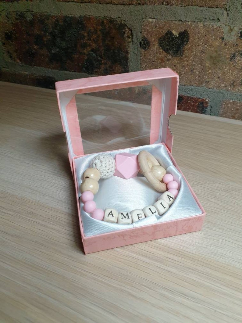 Personalised made-to-order baby wooden teether ring rattle in lovely gift box.