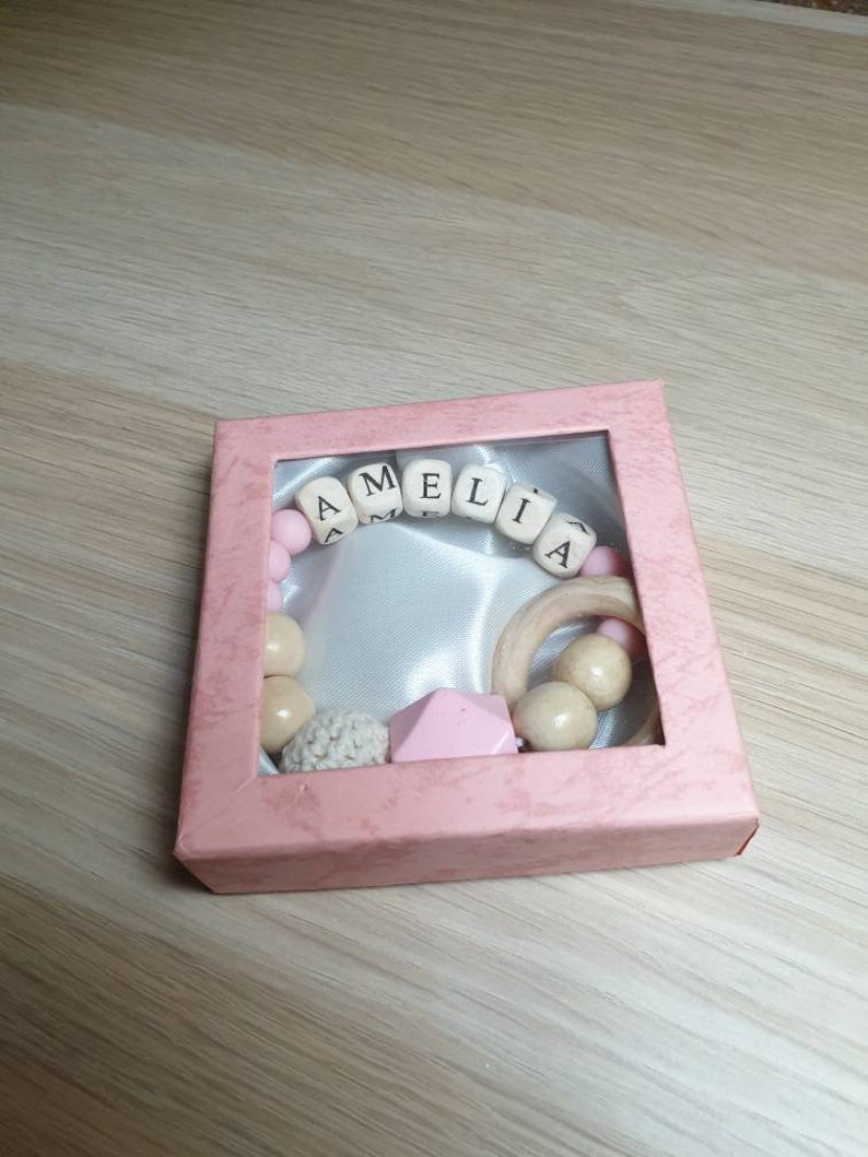 Personalised made-to-order baby wooden teether ring rattle in lovely gift box.